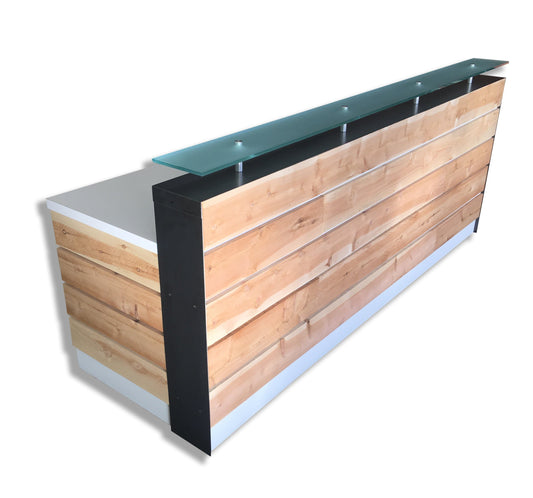 white reception desk with glass riser
